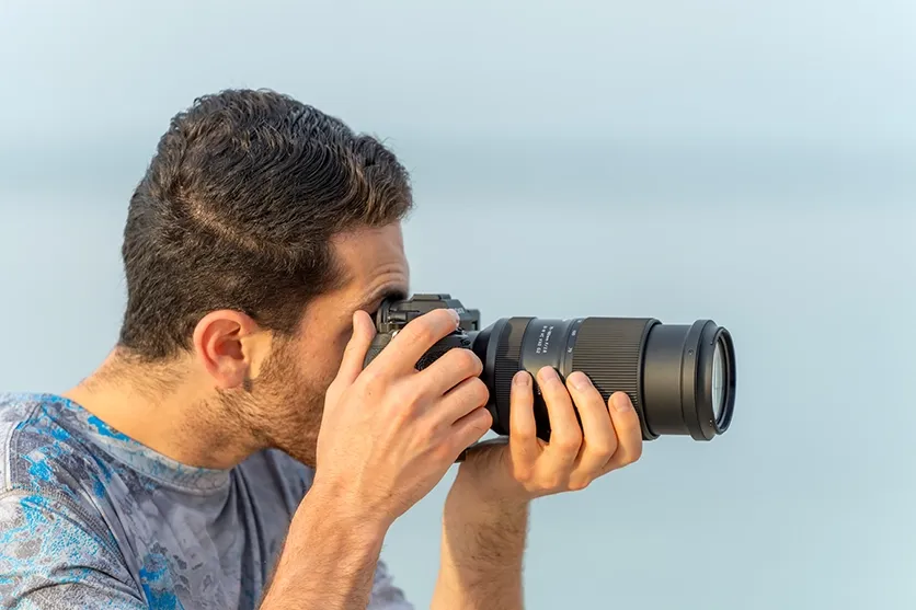 The World’s Smallest and Lightest¹ F2.8 Tele-Zoom Lens — Designed to Fit Comfortably in Your Hand